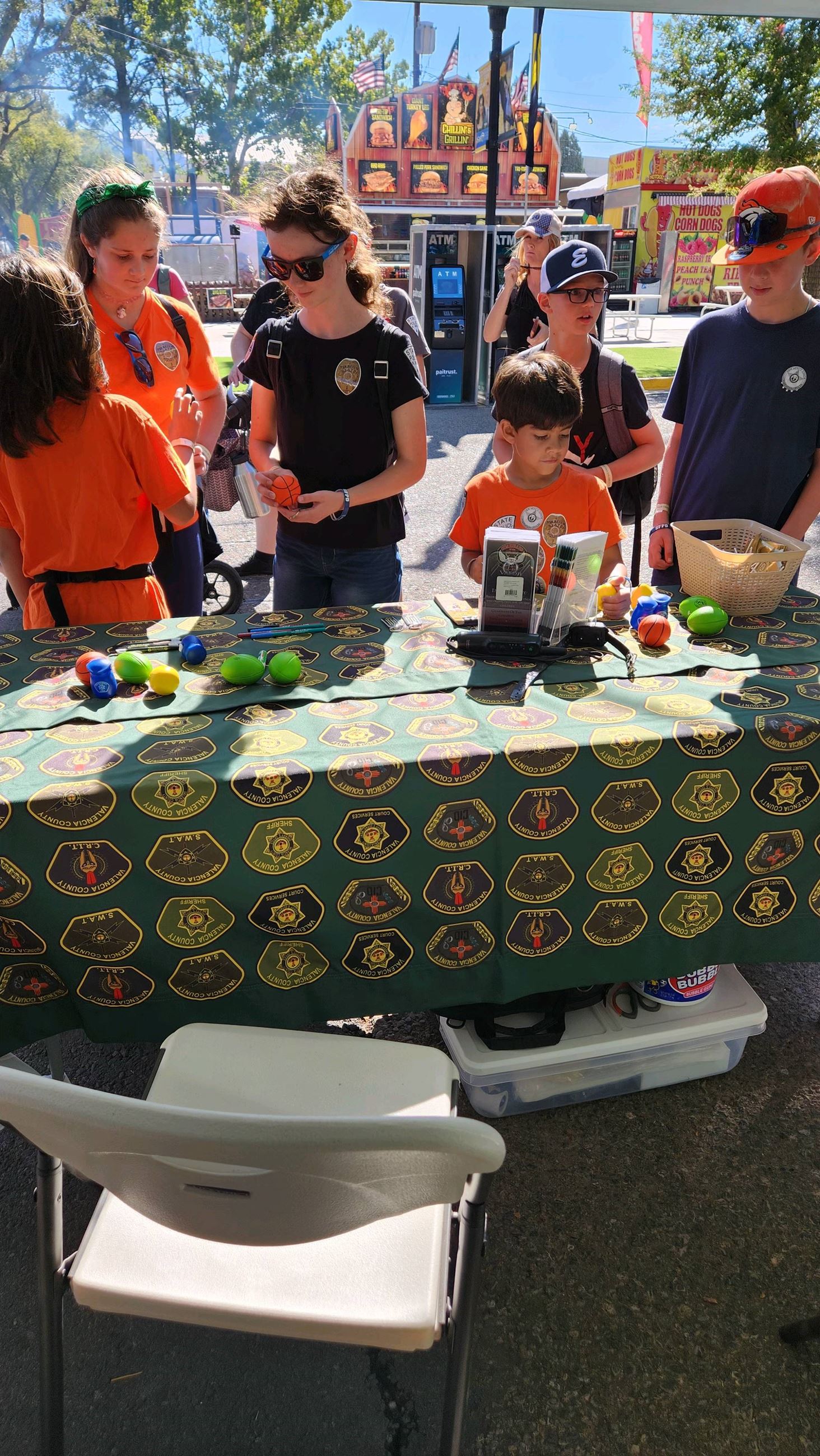group at the Valencia County Sheriff's Office booth